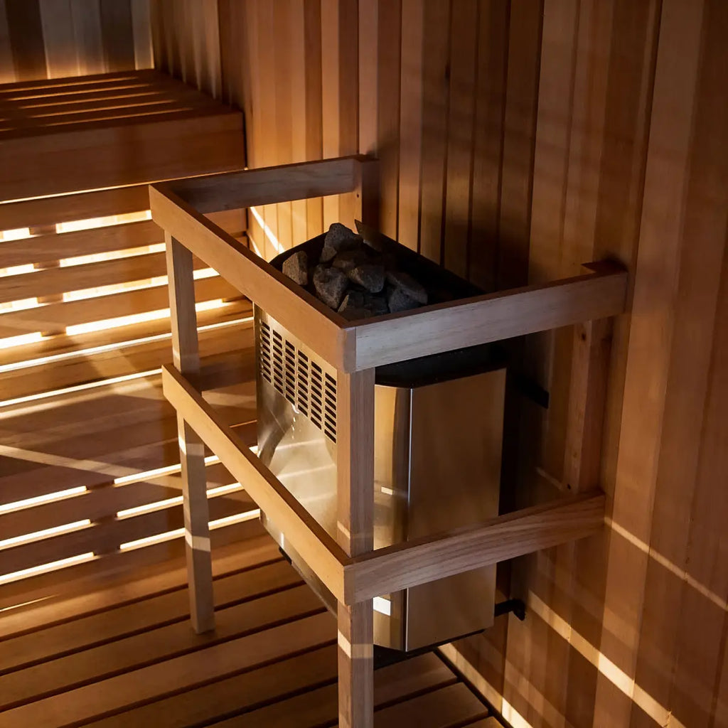 Homecraft H-Series Electric Sauna Heater Wooden sauna bench with a heater inside a wooden sauna room.