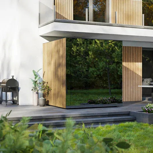 Modern house exterior with a glass wall and wooden panels